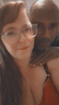 a man and a woman posing for a selfie